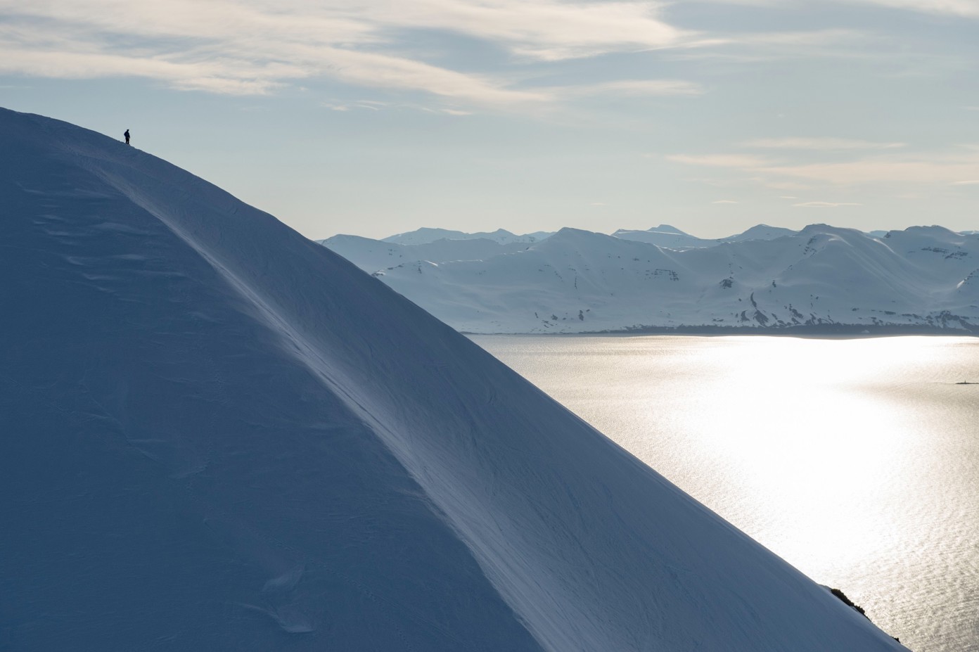 The view of a mountain ridge at sunset in the winter.
